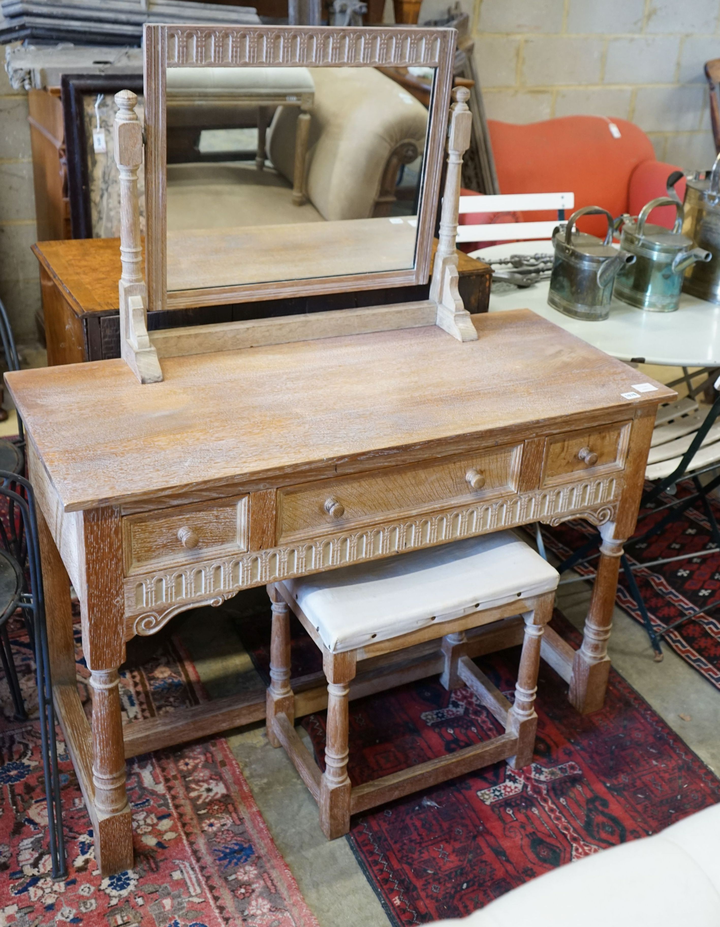 A Heals limed oak chest of drawers, dressing table, width 114cm, depth 51cm, height 135cm and a stool